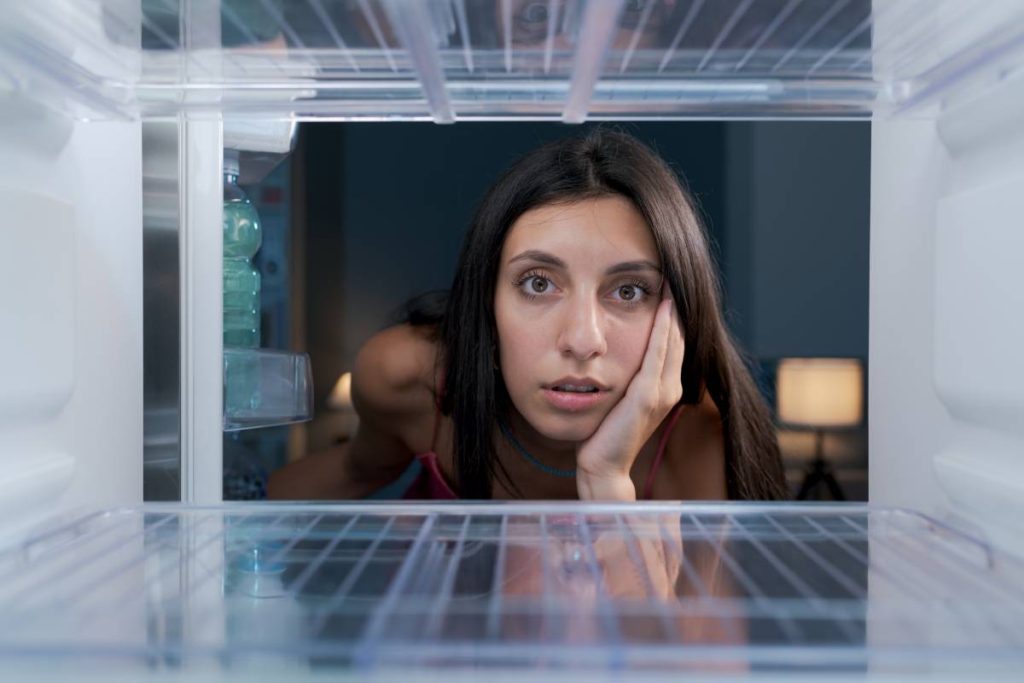 Is it better to keep a freezer full or empty? What is the best thing to clean the inside of a fridge with?